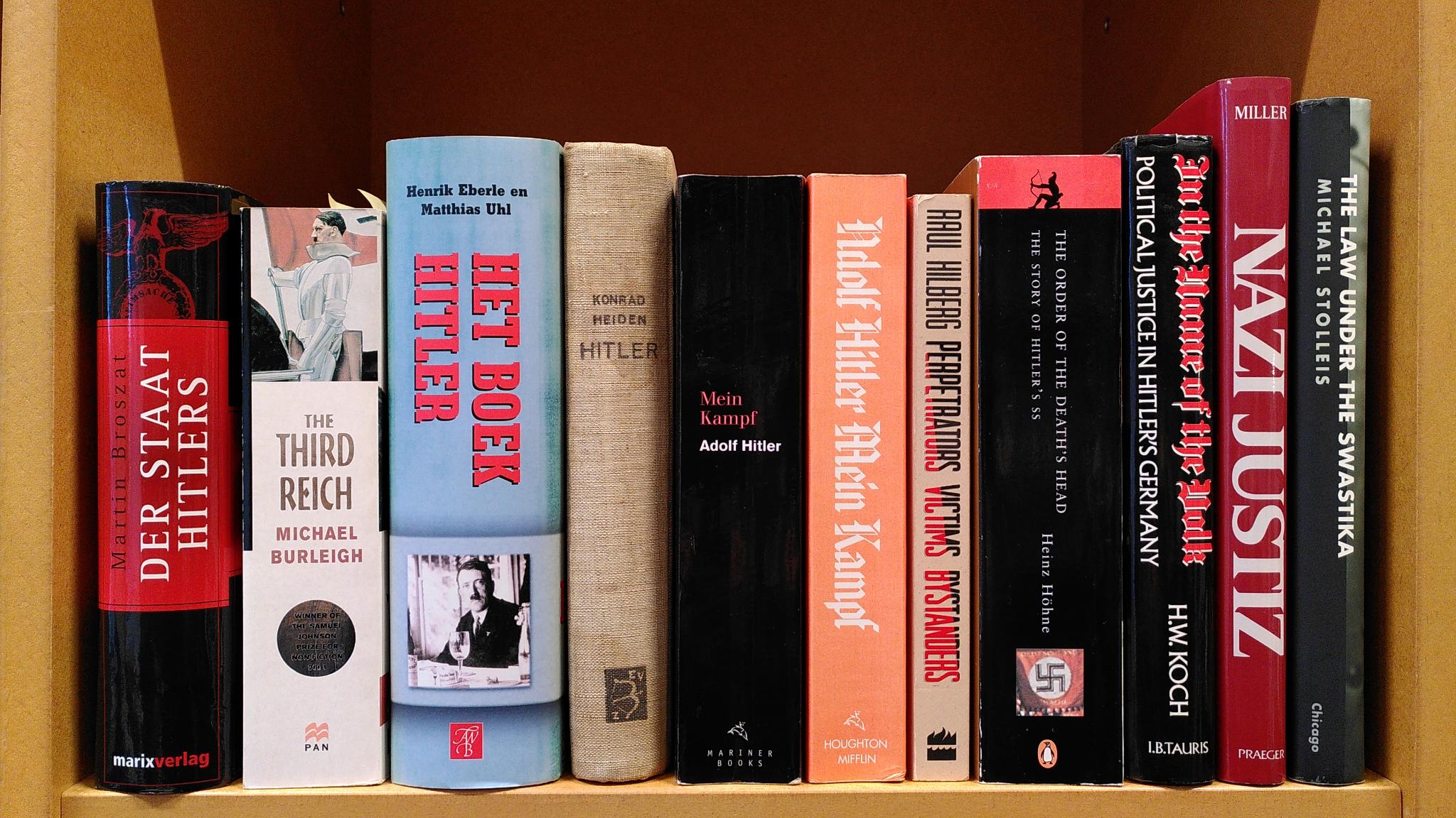 Bookshelf displaying academic publications concerning National Socialism